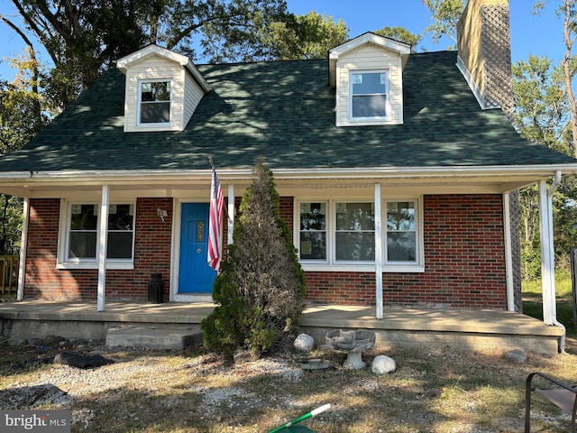 cape cod house with a porch