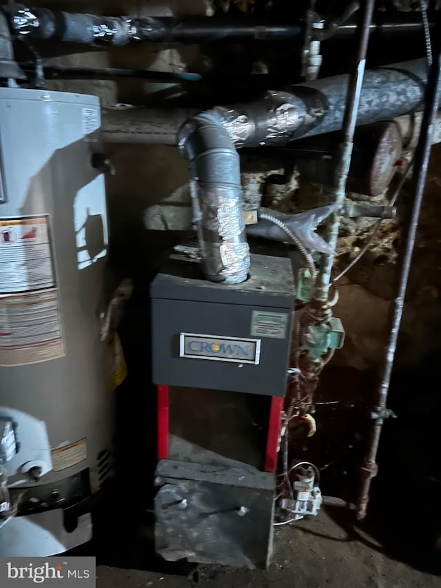 utility room featuring gas water heater