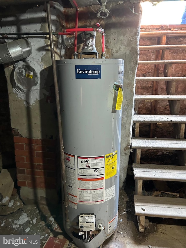 utility room featuring gas water heater