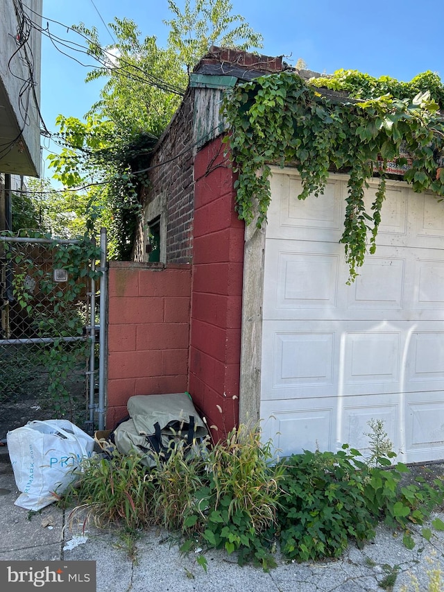 view of side of property with a garage