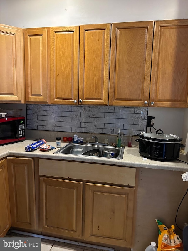 kitchen with decorative backsplash and sink