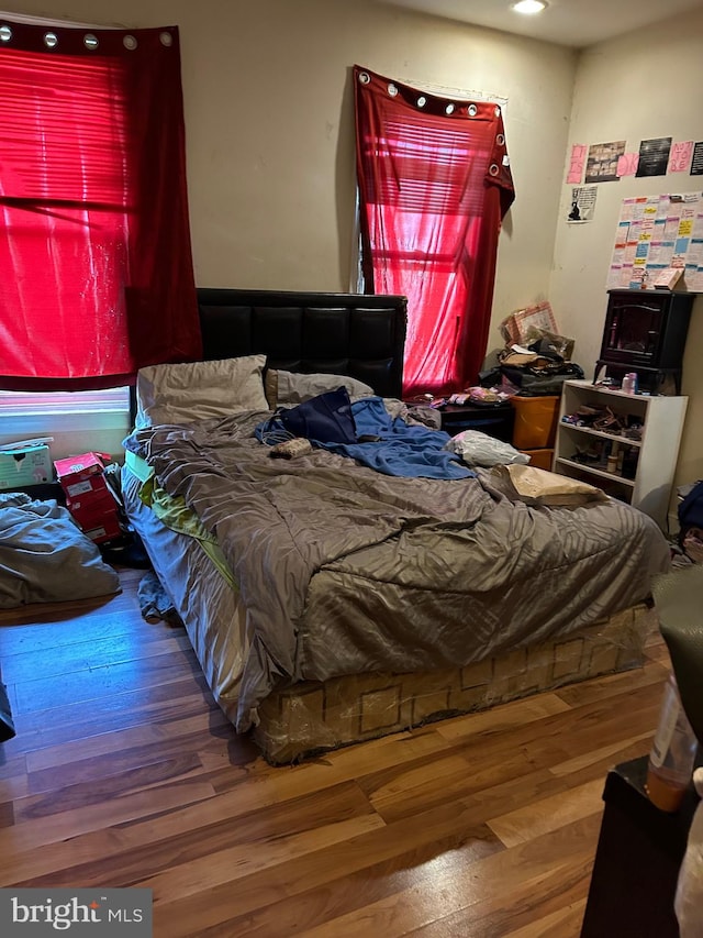 bedroom featuring wood-type flooring