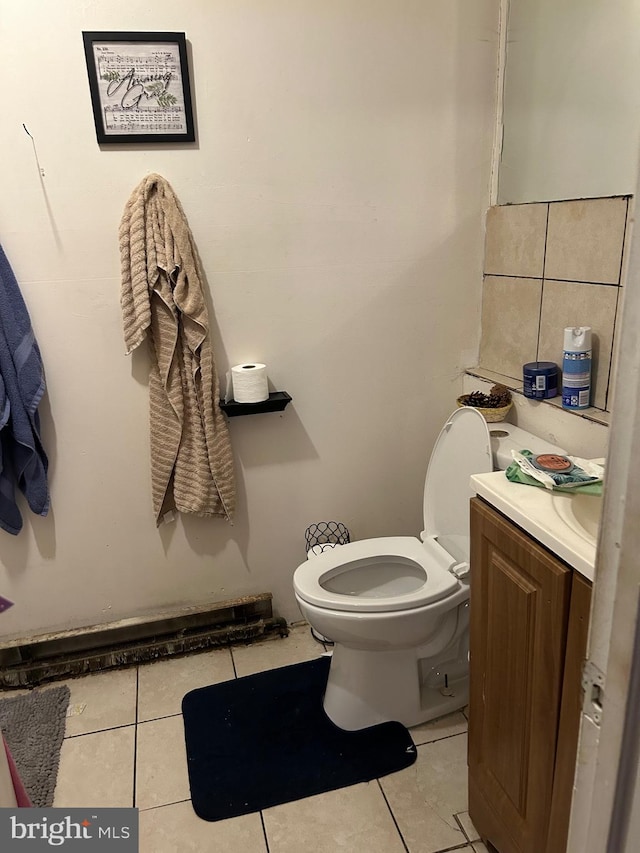 bathroom with vanity, toilet, and tile patterned floors