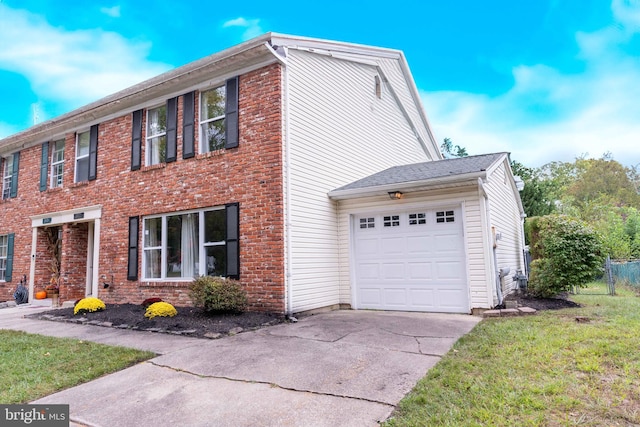 view of home's exterior with a garage and a yard