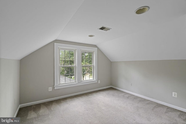 bonus room with carpet floors, baseboards, and visible vents