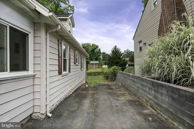 view of property exterior featuring a patio area