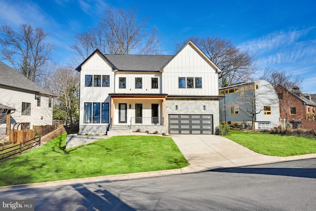 modern farmhouse style home featuring a garage and a front lawn