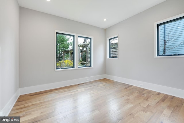 spare room with light hardwood / wood-style floors