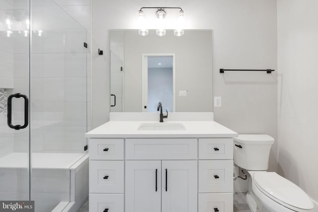 bathroom featuring walk in shower, vanity, and toilet