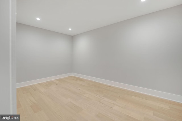 spare room featuring light wood-type flooring