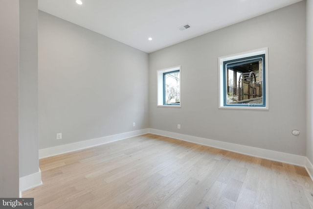 spare room featuring light wood-type flooring