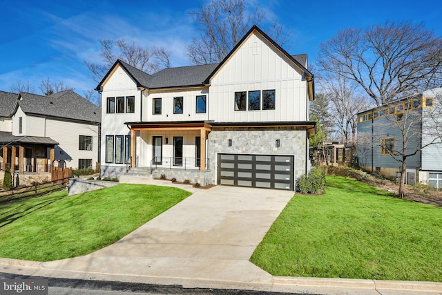 modern inspired farmhouse featuring a porch, a garage, and a front yard