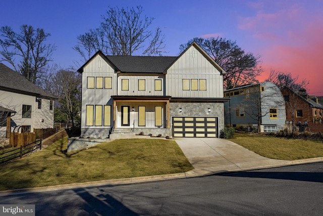 modern farmhouse with a lawn and a garage