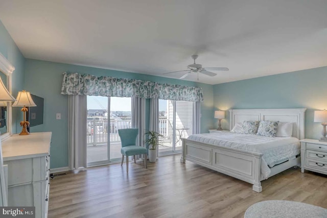 bedroom with light wood-type flooring, ceiling fan, and access to exterior