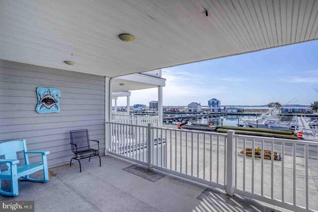 balcony featuring a water view