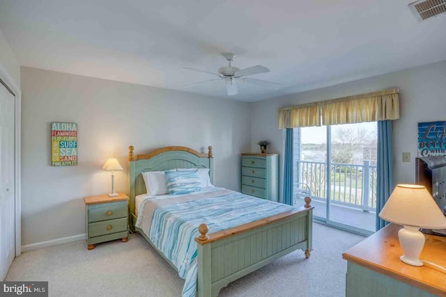 bedroom with ceiling fan, light colored carpet, and access to exterior