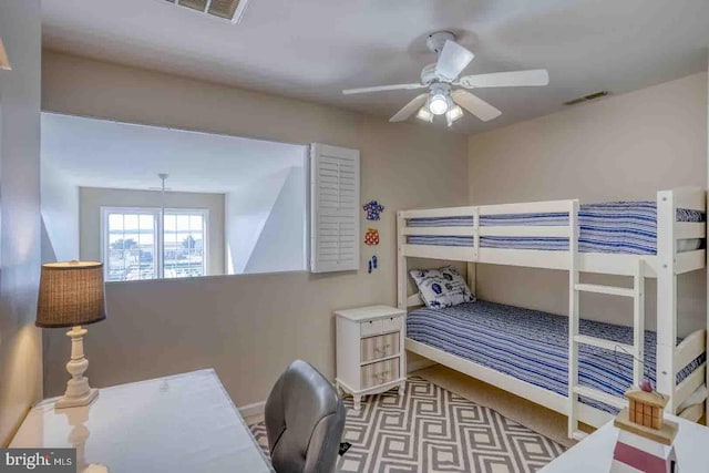 bedroom with ceiling fan and light colored carpet