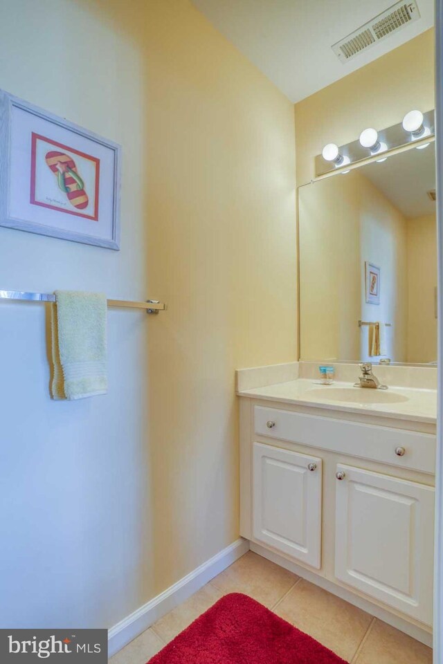 bathroom with tile patterned flooring and vanity