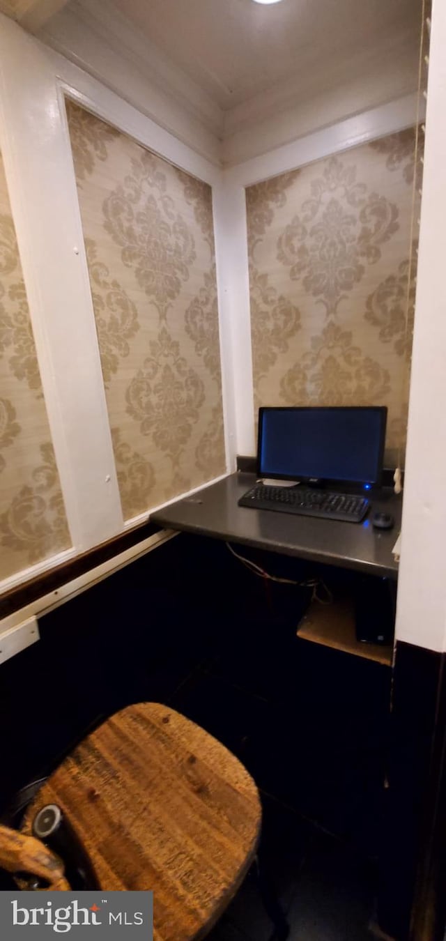 unfurnished office with ornamental molding