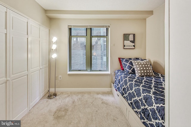 carpeted bedroom featuring a closet