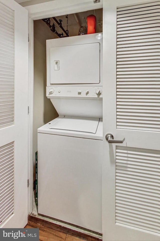 washroom with stacked washer / dryer