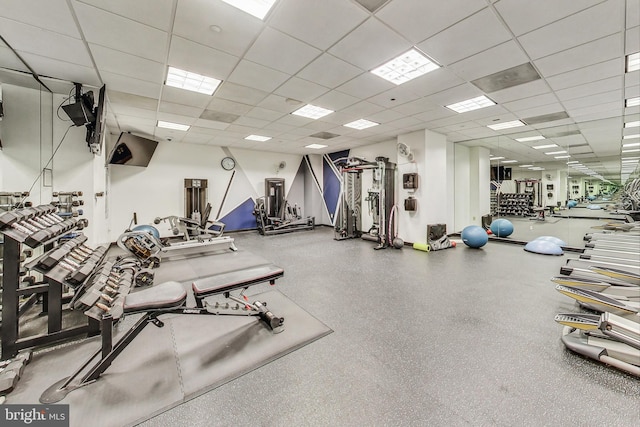 exercise room featuring a paneled ceiling