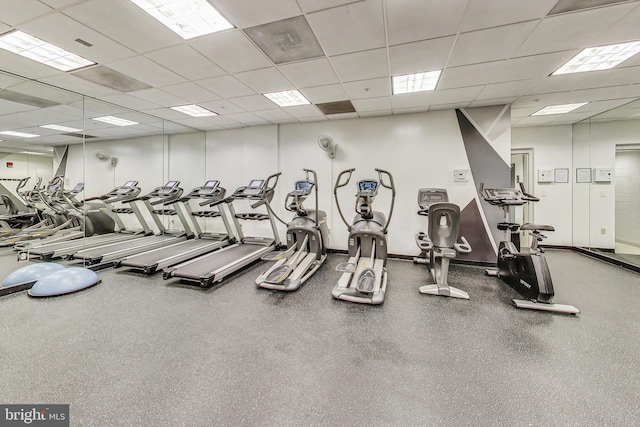 exercise room with a drop ceiling