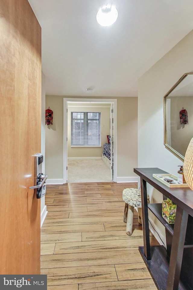 hall with light wood-type flooring