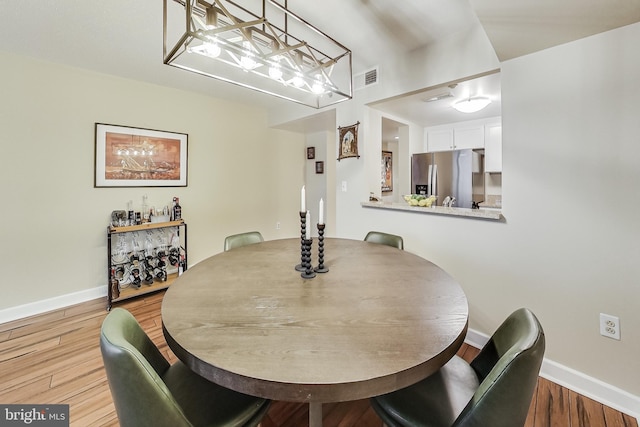 dining space featuring light hardwood / wood-style flooring