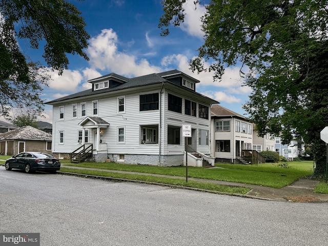 view of front of home with a front yard