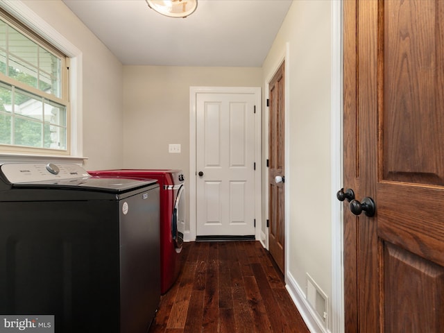 washroom featuring dark hardwood / wood-style floors and separate washer and dryer