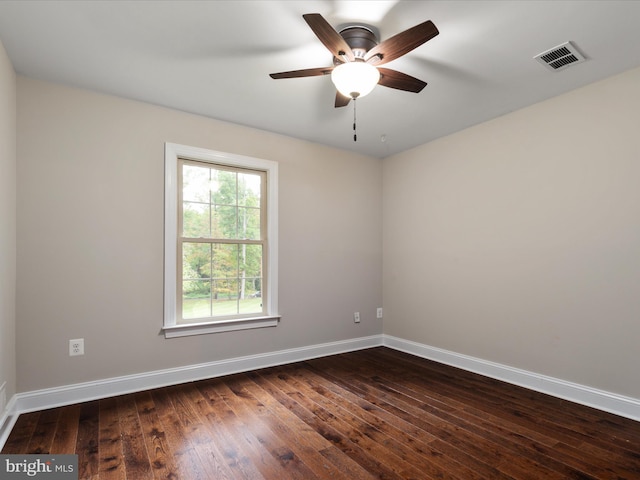 unfurnished room featuring ceiling fan and dark wood-type flooring