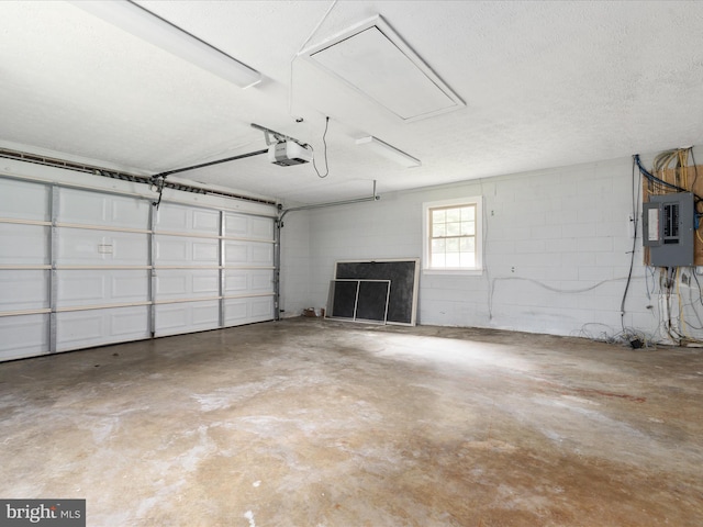 garage featuring a garage door opener and electric panel