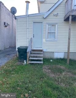 back of house featuring a yard