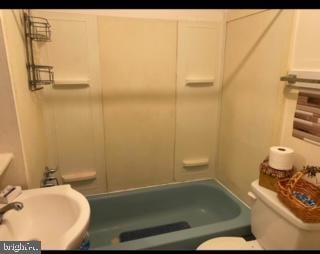 full bathroom featuring bathing tub / shower combination, sink, and toilet