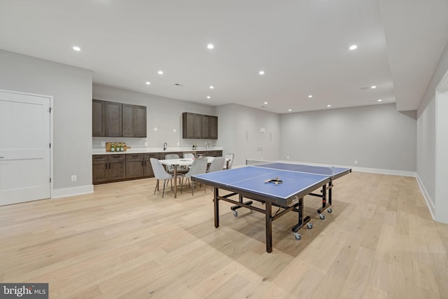 recreation room with light wood-type flooring