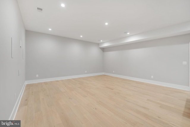 unfurnished room with light hardwood / wood-style floors