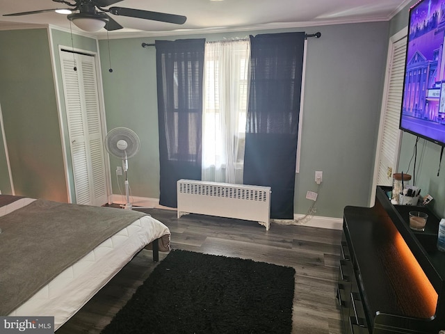 bedroom featuring ceiling fan, radiator, crown molding, and dark wood-type flooring