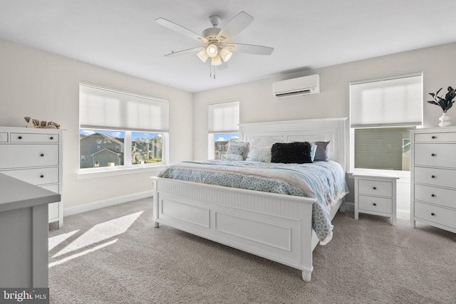 carpeted bedroom featuring ceiling fan, multiple windows, and a wall unit AC