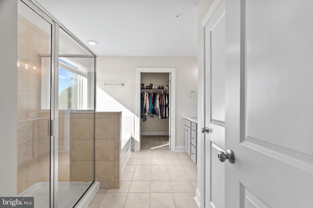 bathroom featuring tile patterned floors, vanity, and independent shower and bath