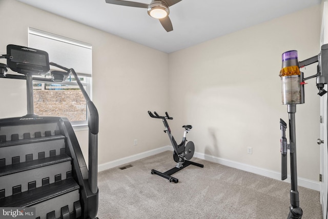 workout area with light carpet and ceiling fan