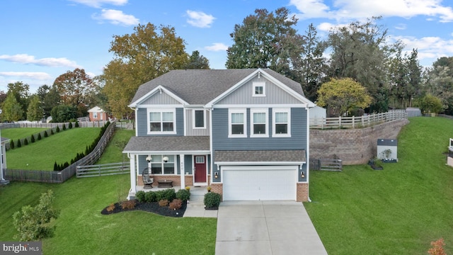 view of front of home with a garage and a front lawn