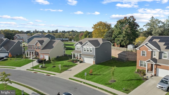 view of front of house with a garage and a front yard