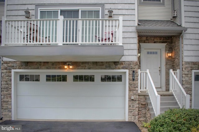 exterior space with a balcony and a garage