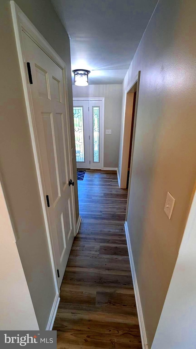 hallway with dark wood-type flooring