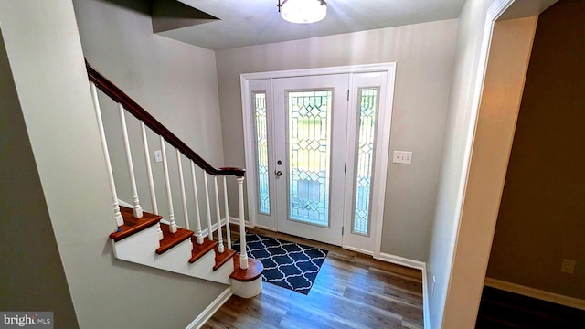 foyer with dark hardwood / wood-style flooring