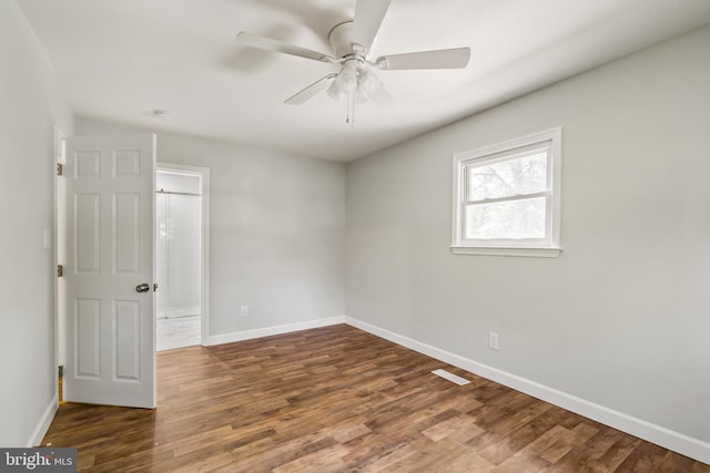 spare room with ceiling fan and hardwood / wood-style floors