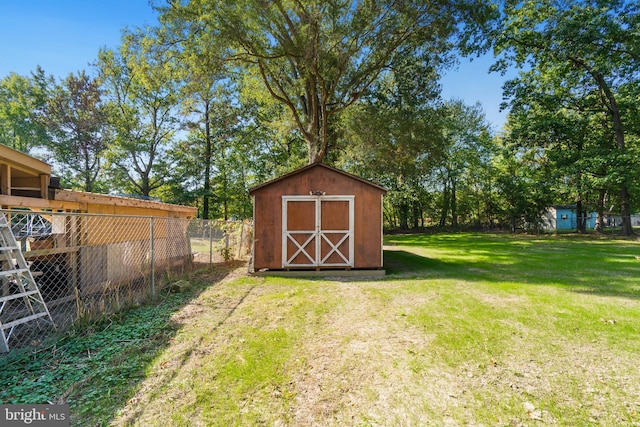 view of outbuilding with a lawn