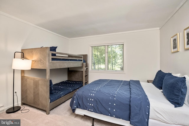 carpeted bedroom featuring ornamental molding