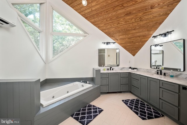 bathroom featuring wood ceiling, tiled bath, vanity, lofted ceiling, and a wall unit AC